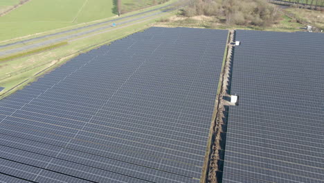 Aerial-view-of-large-solar-panel-field-in-a-rural-area
