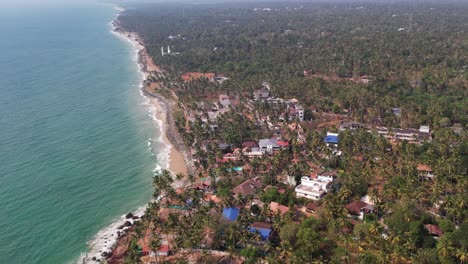Varkala-Aerial-Shot-Of-Drone-Surrounded-By-Trees-And-Buildings