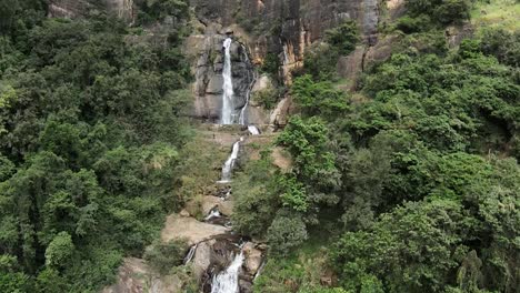 Aerial-cinematic-landscape-of-Ravana-Waterfall,-Sri-Lanka