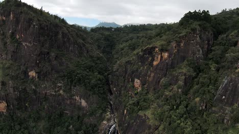 Aerial-view-approaching-green-mountainous-scenery,-Sri-Lanka