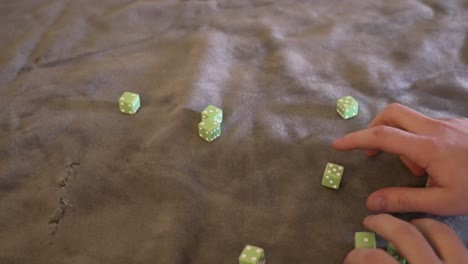 Rolling-ten-lime-green-dice-in-slow-motion
