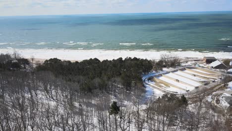 Shot-of-the-shoreline-and-waters-of-Lake-Michigan-in-February-2022