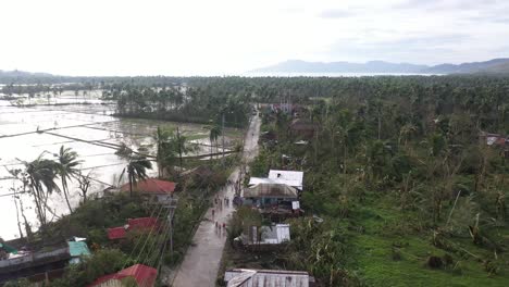 Fly-Over-Road-With-Damaged-Electric-Post-After-Strong-Typhoon-Odette-In-Souther-Leyte-Province-In-The-Philippines