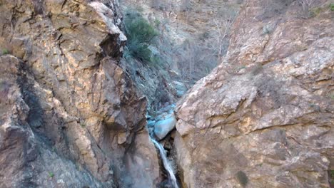 Eaton-Canyon-falls-an-nature-preserve-in-Los-Angeles-County---ascending-aerial-view-of-the-picturesque-waterfall