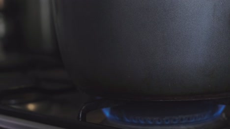 Close-Up-Of-A-Gas-Stove-Burner-Flame-Lit-Up-Upon-Ignition