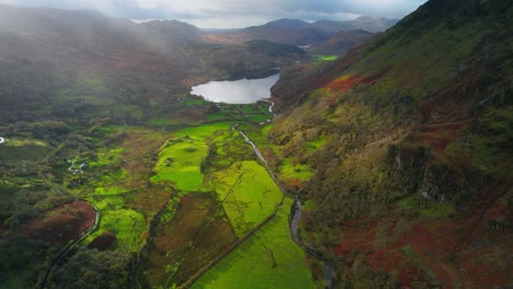 Aerial:-Llyn-Gwynant-lake-in-Snowdonia,-Wales,-beautiful-mountainous-scene