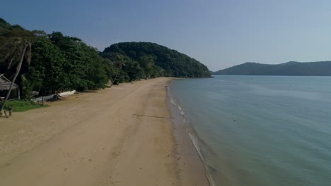 Empty-tropical-beach-Ao-Yon-in-Thailand-on-perfect-sunny-day-with-calm-waves,-aerial