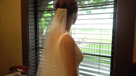 A-bride-looks-out-a-window