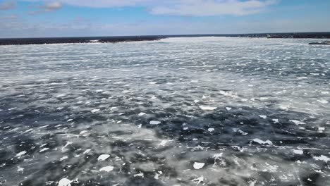 Rightward-Pan-over-a-thick-layer-of-ice-on-Muskegon-lake
