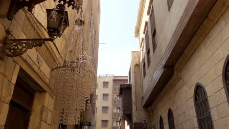 Outdoor-chandelier-and-streetlamp,-picturesque-alley-at-Islamic-Cairo,-Egypt