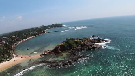 Tilted-FPV-drone-shot-of-stunning-coastal-scenery,-Sri-Lanka