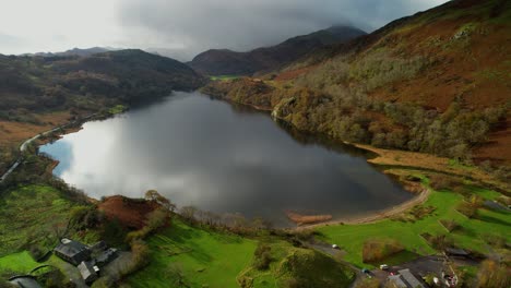 Clouds-reflecting-on-Llyn-Gwynant-lake-and-panoramic-view-of-surrounding-landscape