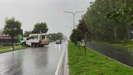 Queensland,-NSW,-Australia,-February-floods---Brisbane-suburban-traffic-is-halted-and-rescue-truck-reverses-into-stranded-traffic,-as-heavy-rain-continues-to-make-conditions-treacherous