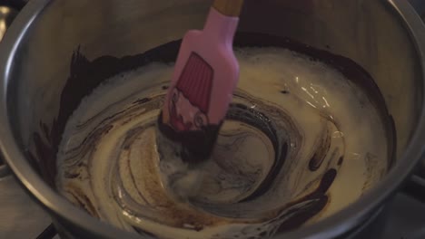 Adding-Heavy-Cream-Into-Caramel-Mixture-While-Stirring