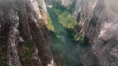 AERIAL---Sumidero-Canyon-and-Grijalva-River-through-clouds,-Chiapas,-Mexico,-reveal