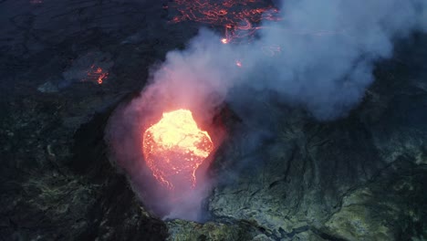 Bubbling-Lava-In-The-Mouth-Of-Volcano-During-Geldingadalur-Eruption-In-Iceland---aerial-drone-shot