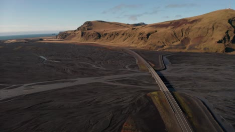 Icelandic-Ring-Road-Highway-1-Through-Mountains-Area,-Iceland---aerial-drone-shot