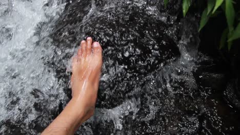 men's-feet-enjoying-the-fresh-river-water