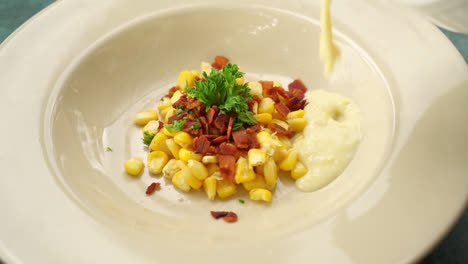 corn-soup-with-crispy-bacon-on-plate