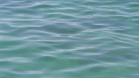 Clear-blue-calm-ocean-water-in-slow-motion