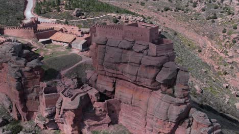 Aerial-drone-view-of-the-Castle-of-Peracense,-in-Teruel-,-bulit-in-the-X-century-with-red-sandstone-in-the-top-of-a-hill