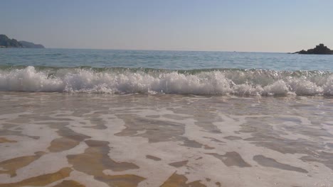 Beautiful-mediterranean-costline-gently-clear-water-waves-rolling-into-shore-sea