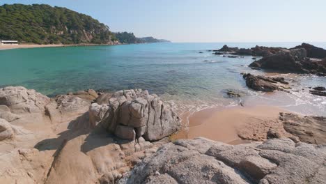 Rocky-shore-beach-landscape-in-Lloret-de-Mar,-costa-brava,-Spain