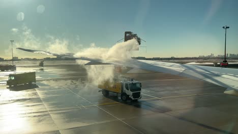 Anti-Icing-Fluids-Sprayed-on-an-Airplane-Wing-to-Remove-Frost-and-Snow---Fixed-Shot