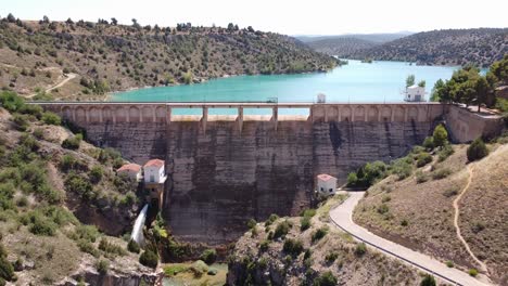 Embalse-del-Arquillo-de-San-Blas,-Teruel,-Aragon,-Spain---Aerial-Drone-View-of-the-Dam-Lake-and-Turquoise-Water-Reservoir