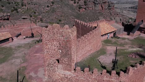 Aerial-drone-view-of-a-tower-of-the-Peracense-Castle,-in-Teruel-,-in-a-round-wiew