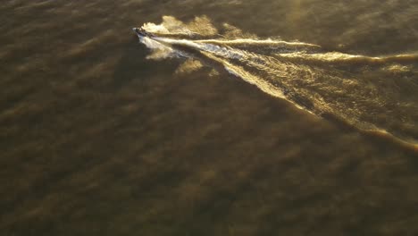Drone-shot-of-Jet-ski-at-sunset
