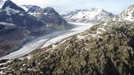 Aerial-flyover-alongside-the-Aletsch-Glacier-in-Wallis,-Switzerland,-which-is-the-longest-glacier-of-the-Swiss-Alps-and-Europe