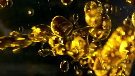 Gelbe-Ölblasen-Auf-Schwarzem-Hintergrund