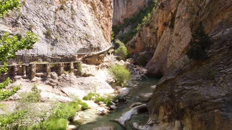 Alquezar-in-Huesca,-Aragon,-Spain-–-Pasarelas-del-Vero-Hike---Aerial-Drone-View-of-the-Walking-Bridge-in-the-Canyon