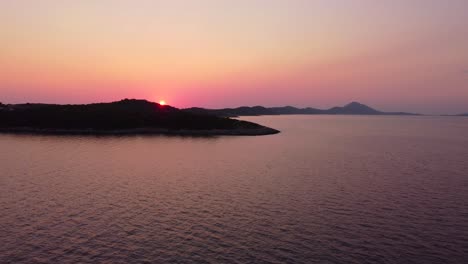 colourful-sunset-above-croatian-island-Mali-Losinj,-jib-down