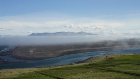 AERIAL---Beautiful-green-hills-in-Hvitserkur,Vatnsnes,-Iceland,-forward-rising