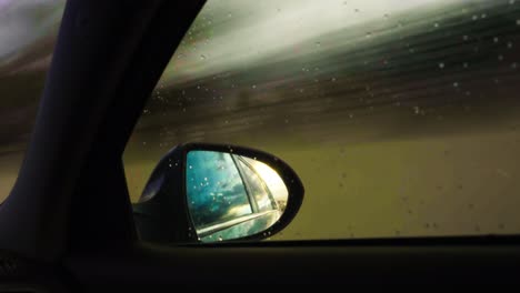 Rearview-mirror-time-lapse-at-sunset