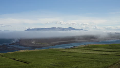 AERIAL---Beautiful-green-hills-in-Hvitserkur,Vatnsnes,-Iceland,-forward-lowering