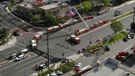 Firetrucks-and-other-first-responders-wait-for-a-funeral-procession