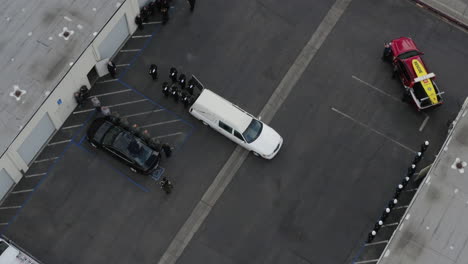 Aerial-drone-of-police-officers-saluting-a-casket