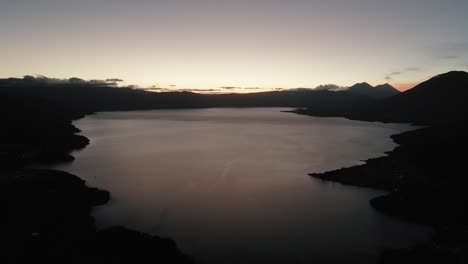 Sunrise-view-of-Lake-Atitlan,-Acatenango,-Fuego,-Toliman,-and-San-Pedro-volcanoes-in-Guatemala