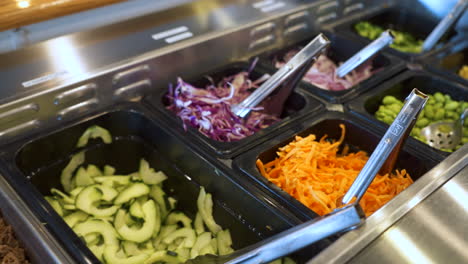 Salad-bar-filled-with-colorful-vegetables,-protein,-poke-bowl,-4K