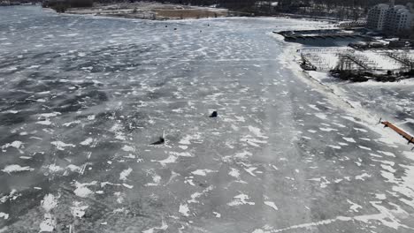 Two-ice-racers-making-lines-on-the-frozen-surface-of-Muskegon-Lake