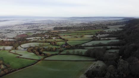 Aerial-panning-left-shot-of-East-Hill-and-the-Otter-valley-Devon-England-on-a-frosty-morning