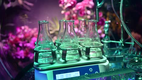 4K:-Laboratory-flasks-with-transparent-liquid-Substances,-Plant-and-flower-laboratory,-Agriculture-experiments-concept-inside-Plants-Nursery