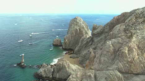 Aerial-shot-of-boats-in-the-Arch-of-Los-Cabos,-Baja-California-sur