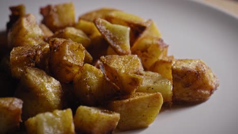Close-up-View-of-Roasted-Potatoes-Presented-on-a-Plate---Truck-Shot