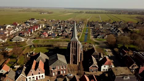 Aerial-of-Oldemarkt,-dolly-shot,-pull-out-of-church,-revealing-town