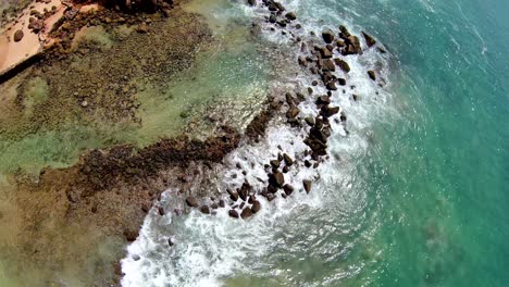 Aerial-tilt-down-and-up-of-cinematic-coastal-landscape,-Mirissa,-Sri-Lanka