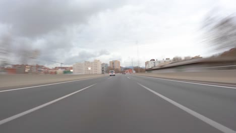 driving-a-car-on-the-barcelona-motorway-highway-in-spain,-fast-camera-mounted-on-the-front-c32-ronda-de-dalt